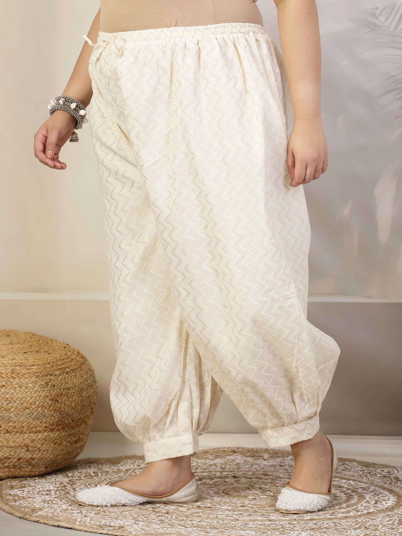 Women self design cotton lurex loose fit Afghani salwar with elastic waistband and drawstring closure.