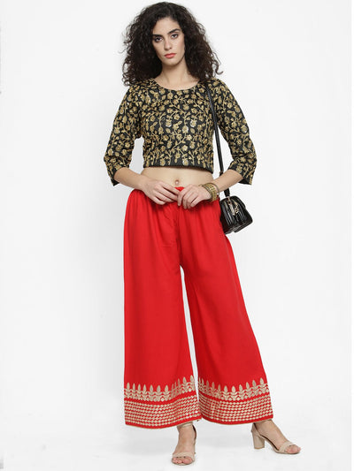 Red rayon palazzo with gold Gotta Patti hem and elastic waistband.