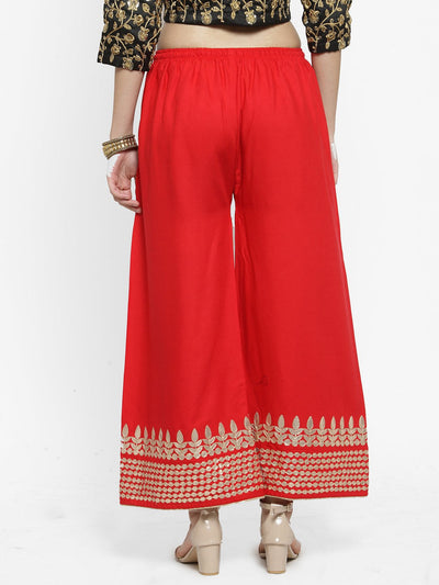 Red rayon palazzo with gold Gotta Patti hem and elastic waistband.