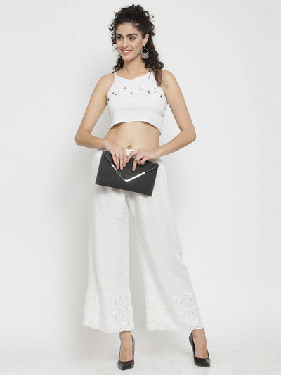 White Chikankari Rayon Palazzo paired with a white top and black clutch.