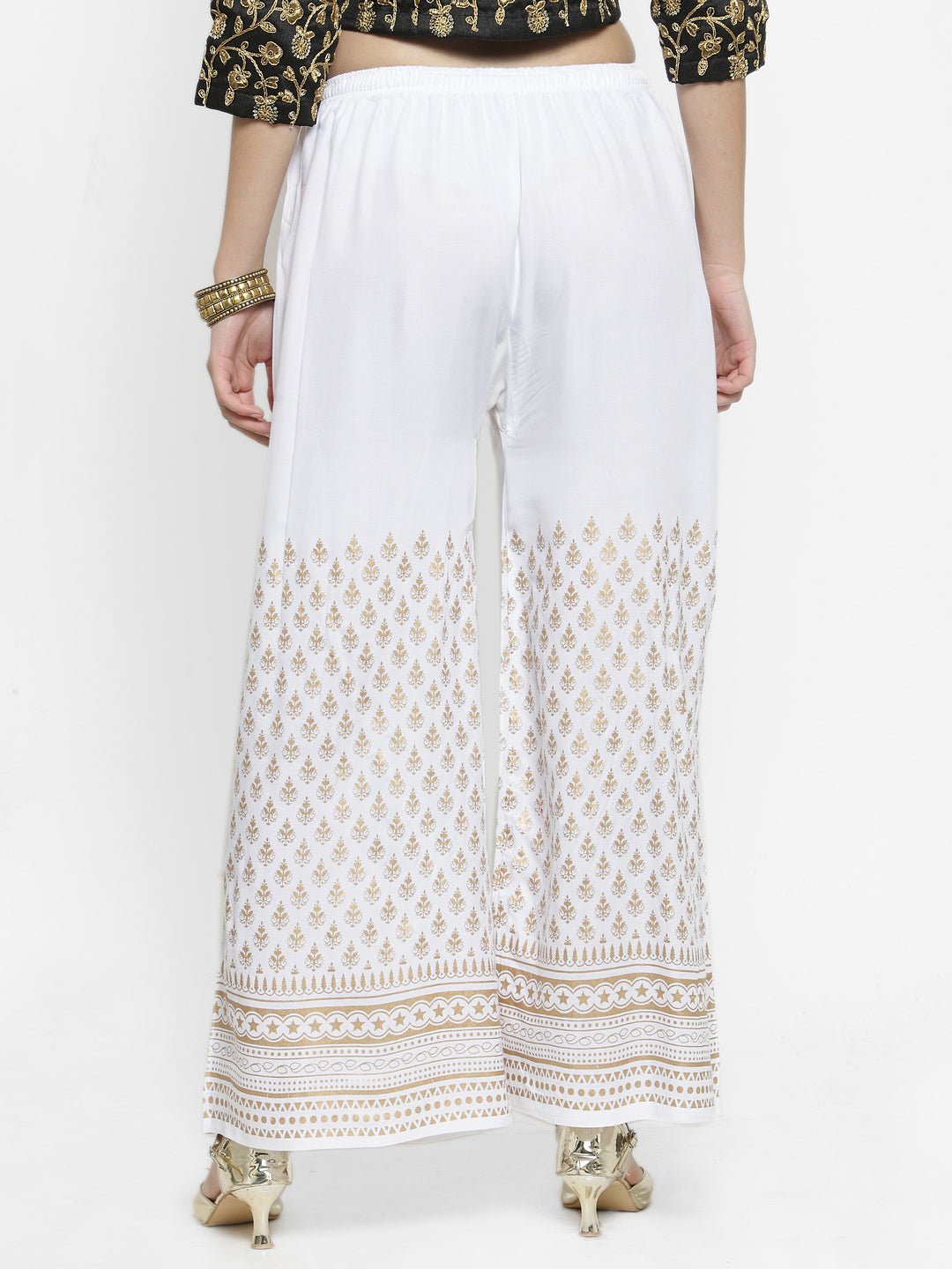 White printed rayon palazzo pants with intricate designs for a fashion-forward casual look.