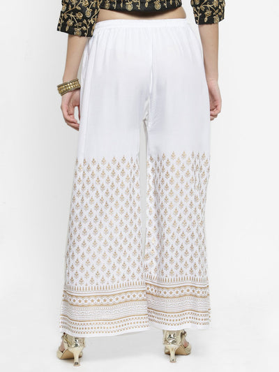 White printed rayon palazzo pants with intricate designs for a fashion-forward casual look.