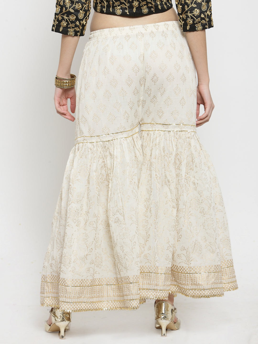 Off-White Printed Gharara with gold Gotta Patti hem and flared cut.
