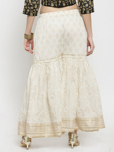 Off-White Printed Gharara with gold Gotta Patti hem and flared cut.