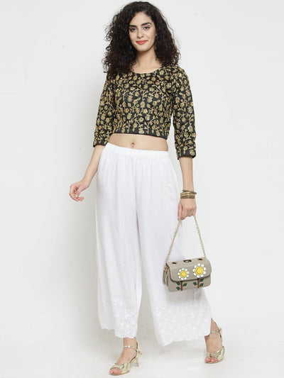 White half chikankari rayon sharara with floral top and handbag.