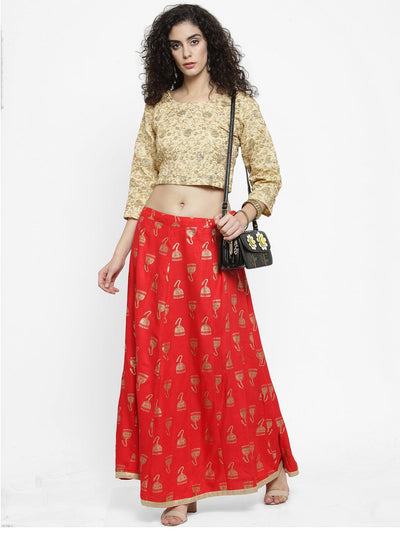 Red printed maxi skirt made from Rayon fabric, styled with a patterned top and accessories.