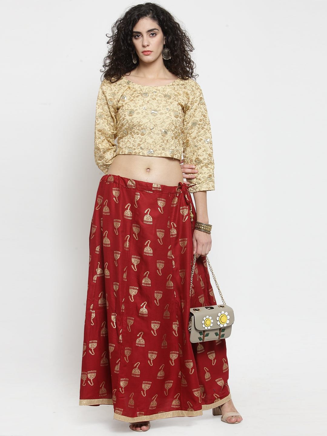 Maroon printed maxi skirt with floral patterns and a casual top.