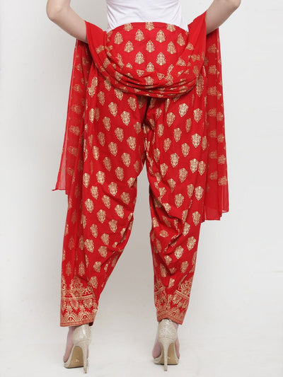Red printed salwar and dupatta set made from cotton, featuring bright and fashionable patterns.