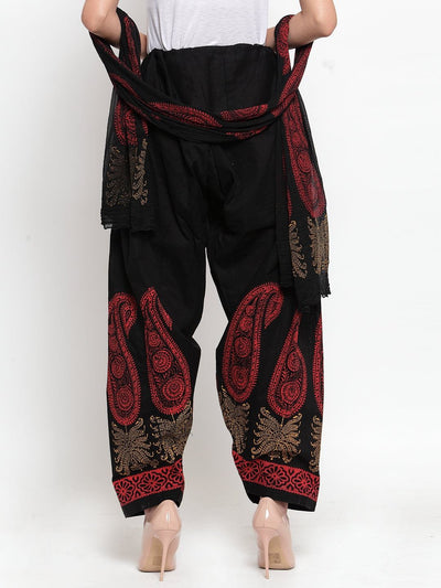Black printed salwar and dupatta set in cotton from Clora, styled with intricate patterns.