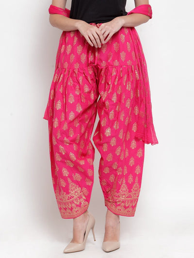 Pink printed salwar dupatta set made from cotton with vibrant patterns.
