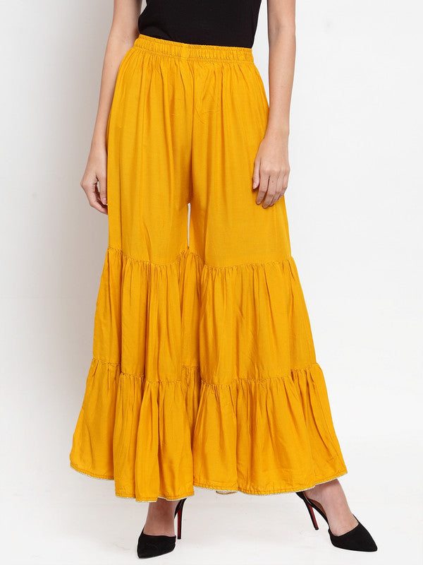Mustard flared solid gharara with golden gota hem and rayon fabric.