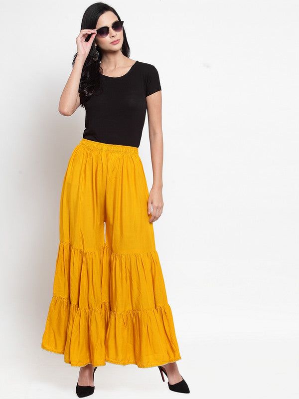 Mustard flared solid gharara with golden gota trim and flared design.