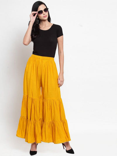 Mustard flared solid gharara with golden gota trim and flared design.