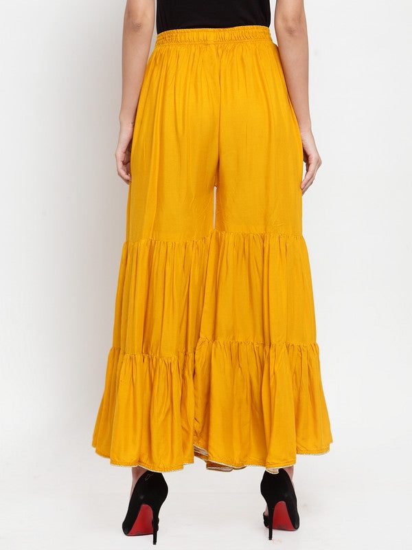 Mustard flared solid gharara with golden gota hem detailing.
