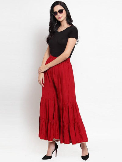 Maroon flared solid gharara with golden gota hem detailing.