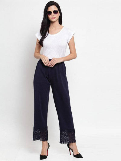 Navy blue viscose lace palazzo worn with a white top, styled with heels.