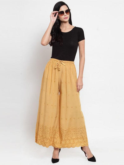 Fawn Chikankari Rayon Sharara with intricate embroidery, paired with a black top.