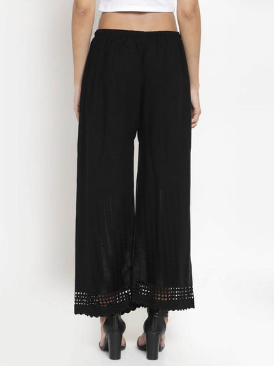 Black self-design rayon palazzo with chikankari detailing.