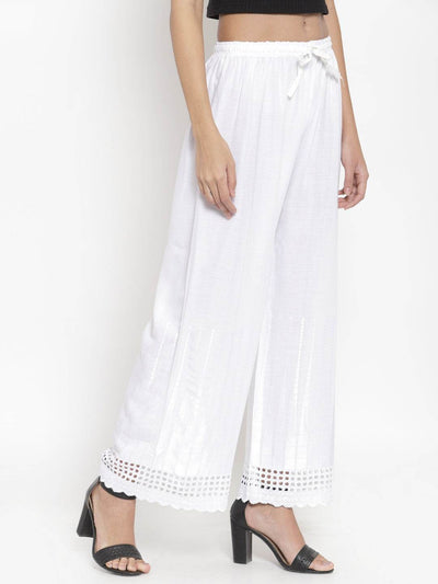 White self-design rayon palazzo with Chikankari detail.