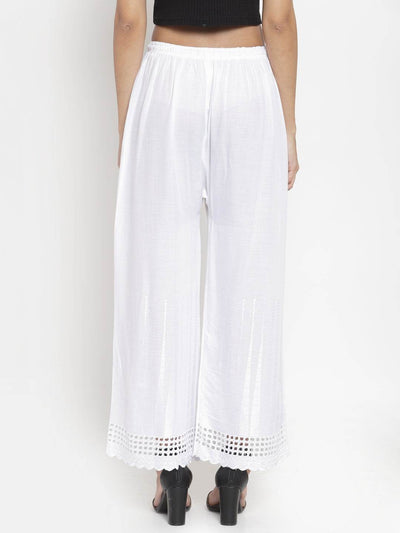 White self-design rayon palazzo with Chikankari detail.