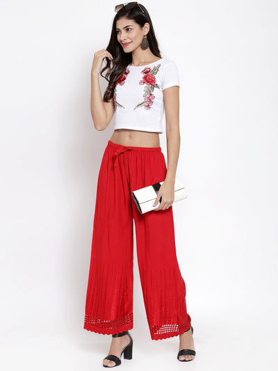 Red self-design rayon palazzo with chikankari detailing.
