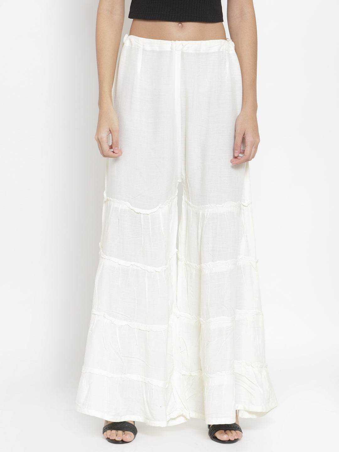 Cream flared solid gharara for women by Clora.