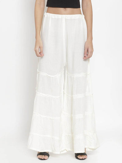 Cream flared solid gharara for women by Clora.
