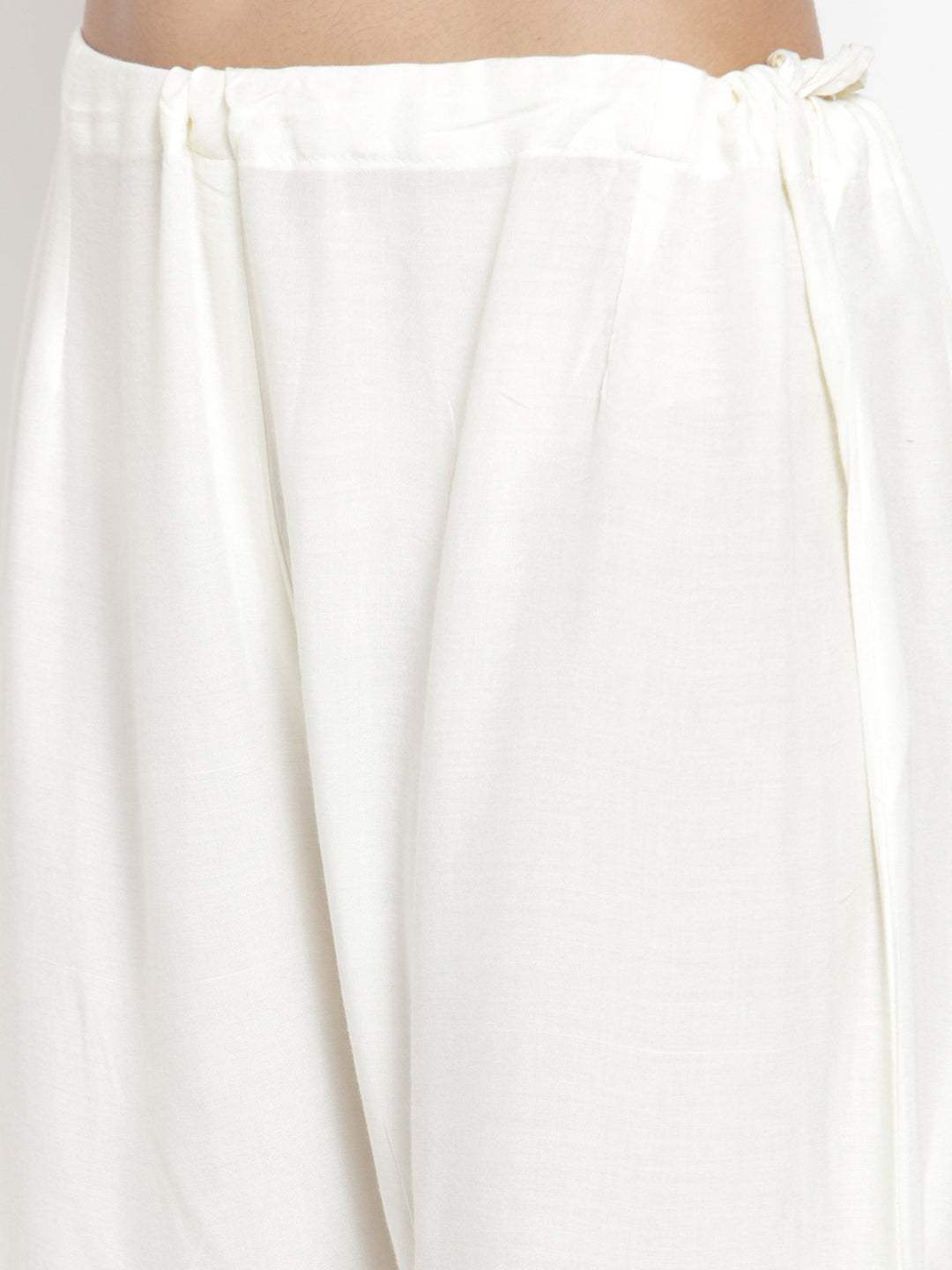 Cream flared solid gharara with elastic waistband detail.