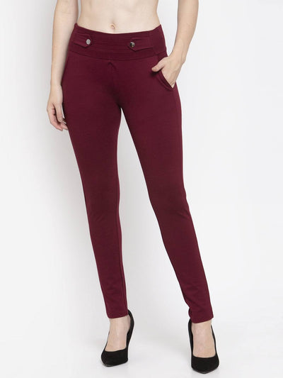 Maroon Smart Fit Jeggings with button detail and pockets, paired with heels.