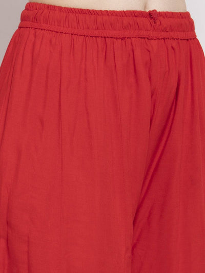 Red flared embellished sharara in soft rayon fabric.