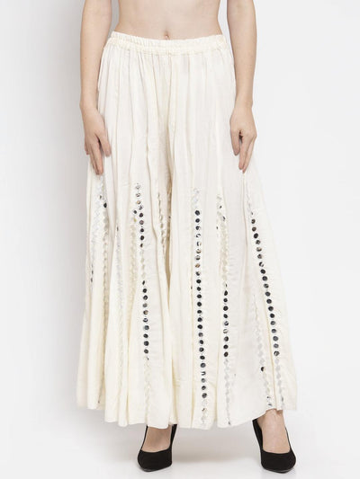 Cream flared embellished sharara with stylish design in soft rayon fabric.