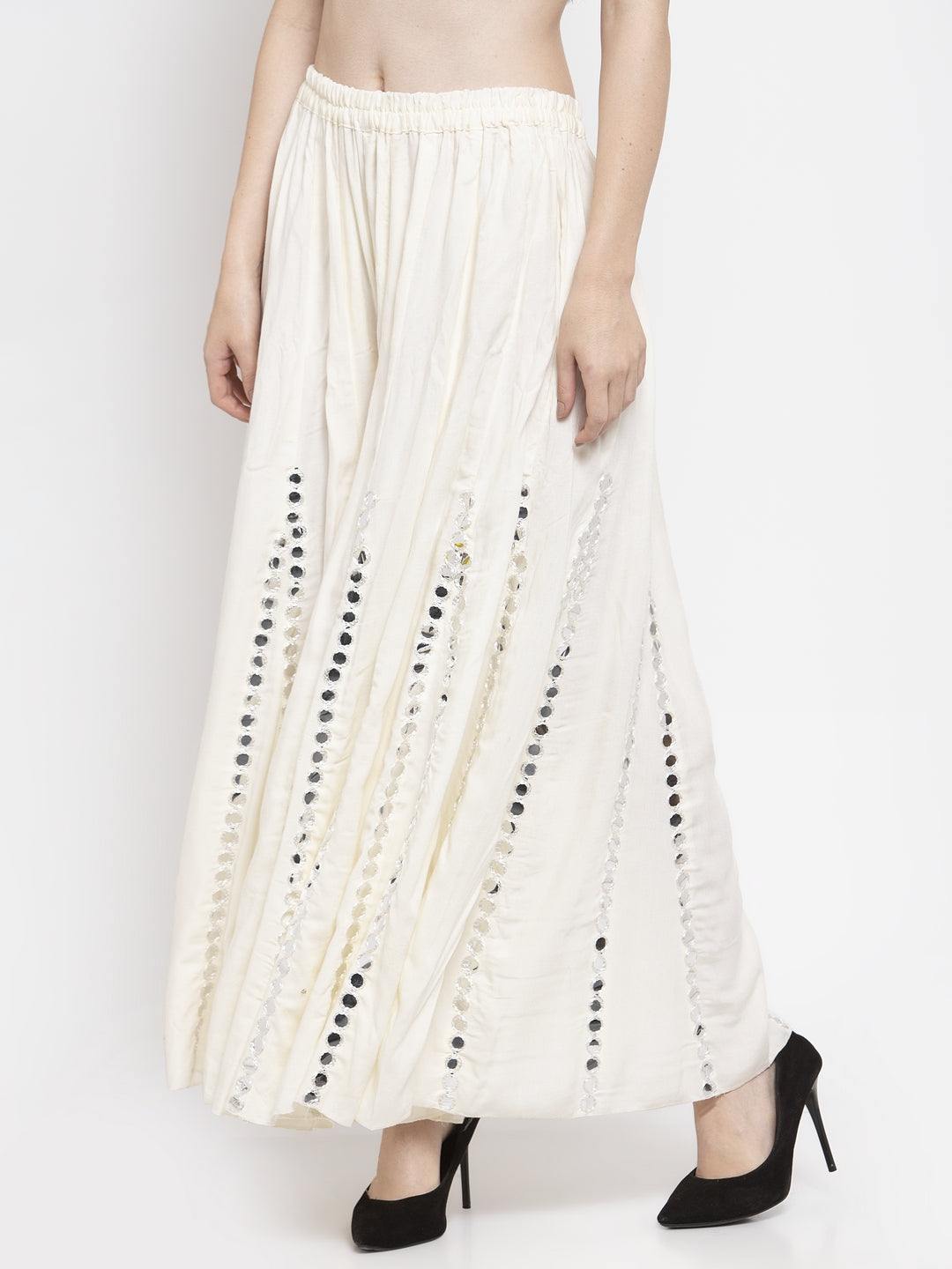 Cream flared embellished sharara made from soft rayon fabric, offering elegance and comfort.