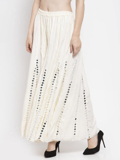 Cream flared embellished sharara made from soft rayon fabric, offering elegance and comfort.