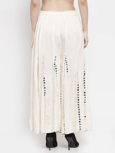 Cream flared embellished Sharara with stylish design and soft Rayon fabric.