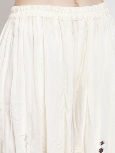 Cream flared embellished Sharara in soft Rayon fabric.