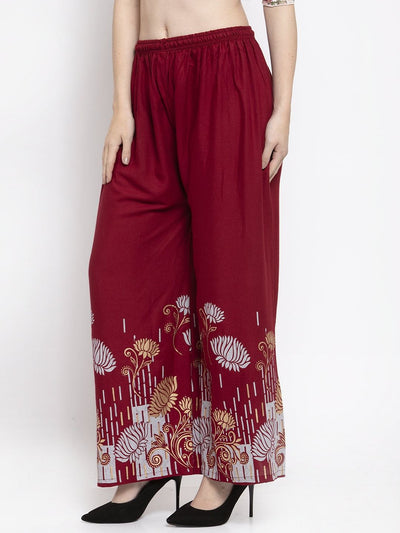 Maroon printed rayon palazzo with elasticated waistband and floral design.