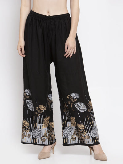 Black printed rayon palazzo with elasticated waistband and drawstring.