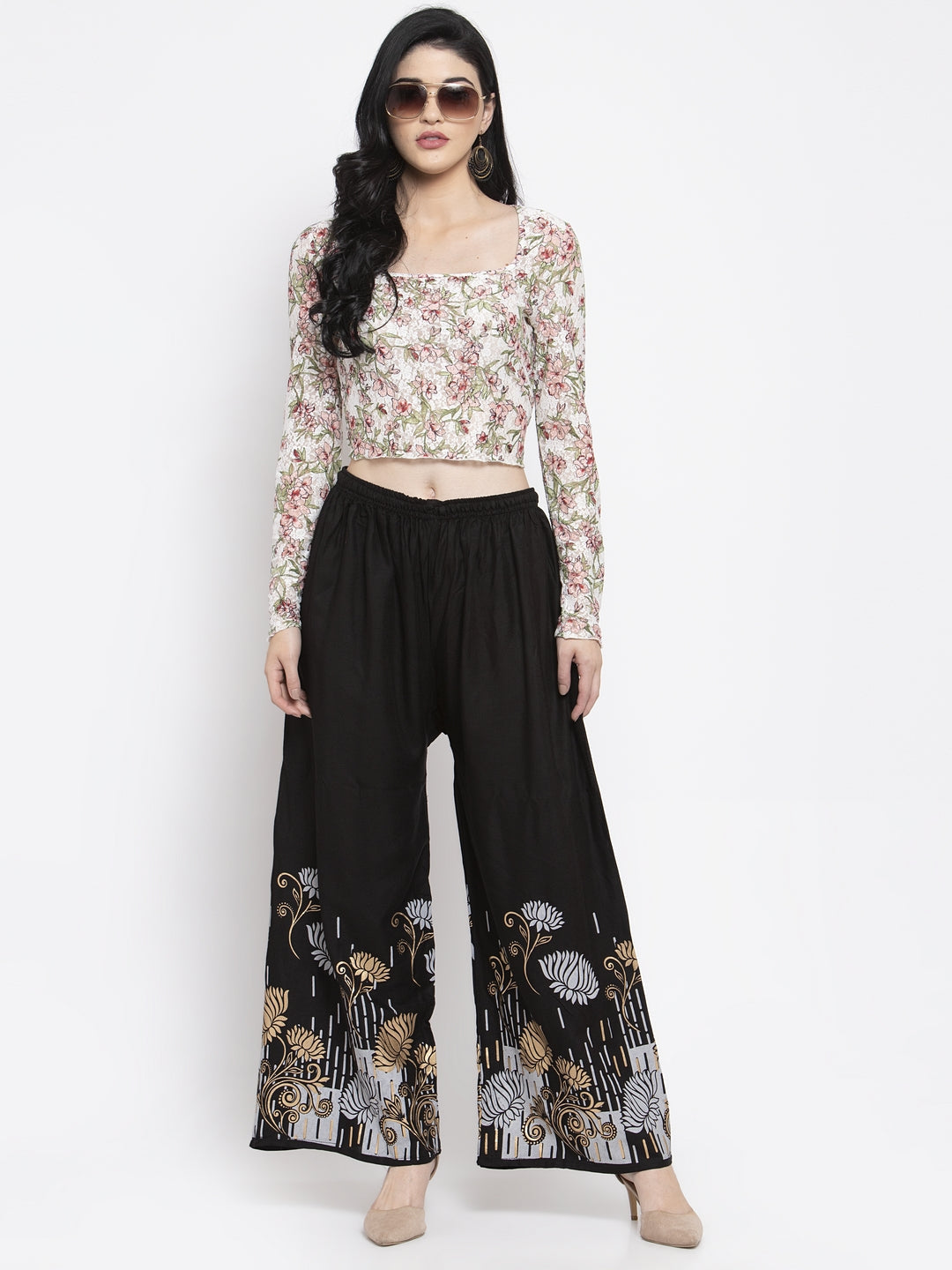 Black printed rayon palazzo with elastic waistband and drawstring.