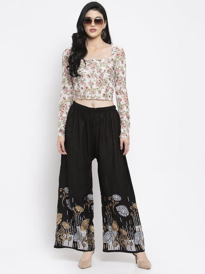 Black printed rayon palazzo with elastic waistband and drawstring.