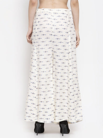 Cream flared printed rayon sharara with elastic waistband, perfect for pairing with a Kurta and high heels.