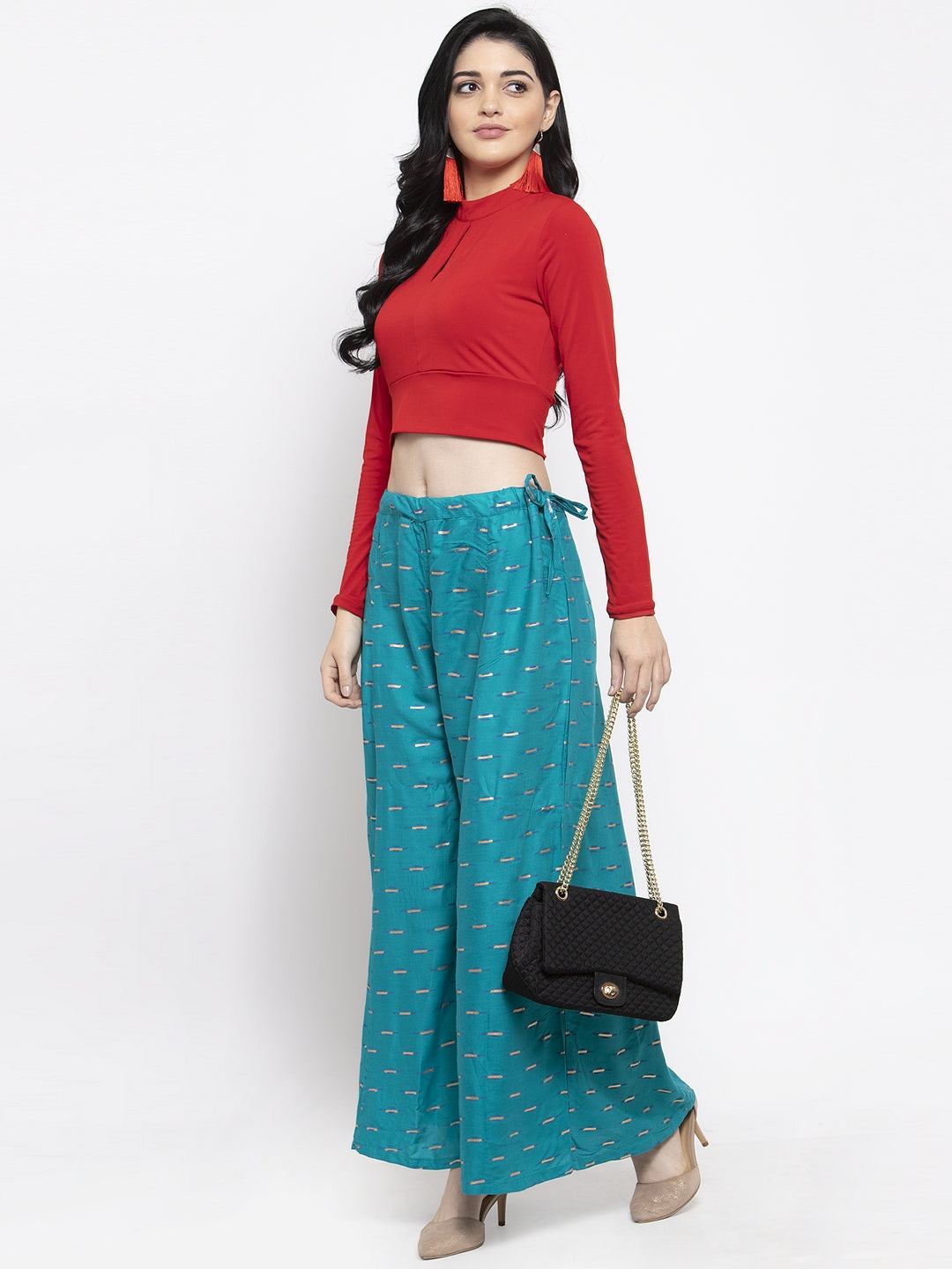 Turquoise flared printed rayon sharara with elasticated waistband.