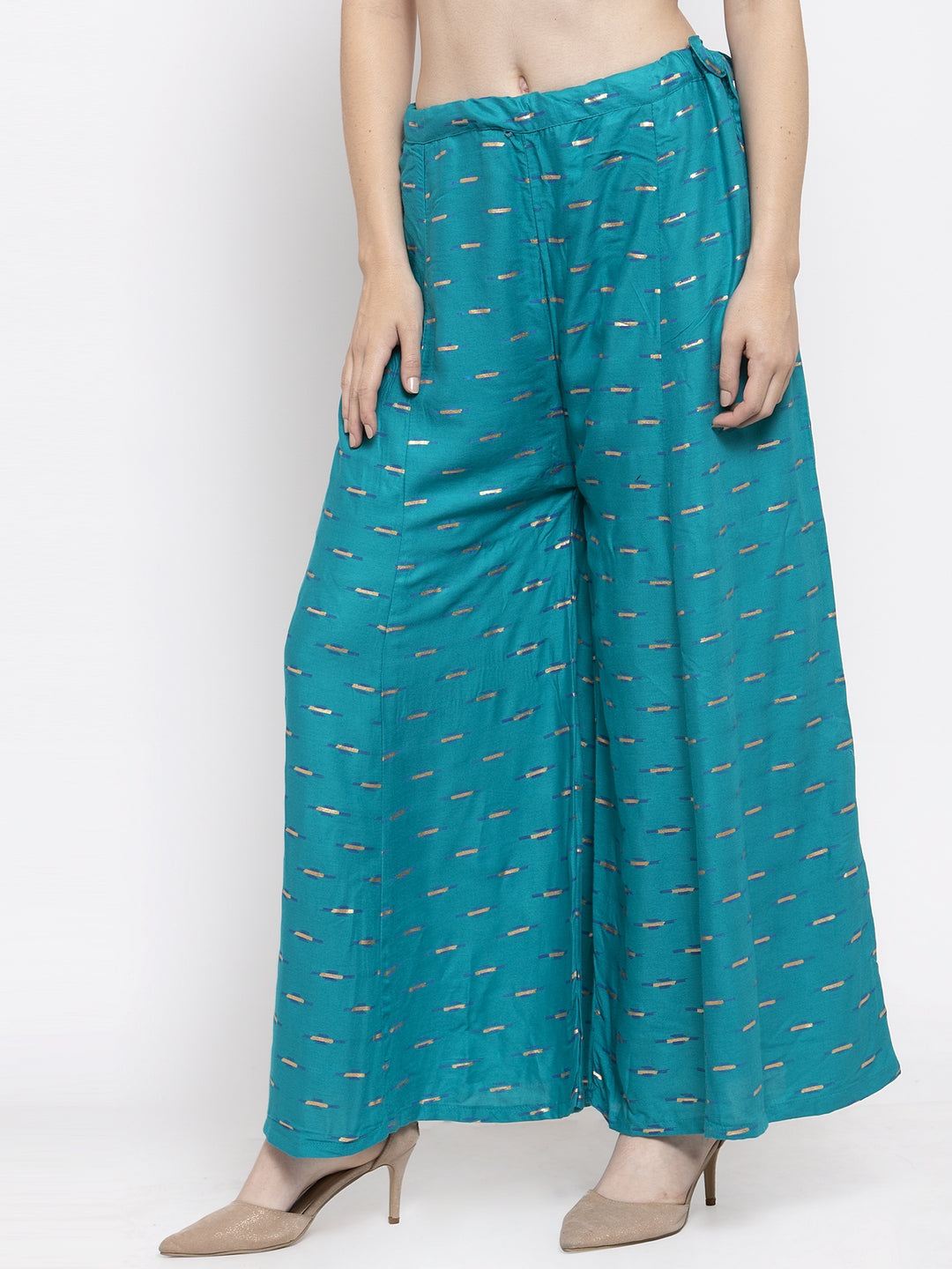Turquoise flared printed rayon sharara with elastic waistband.