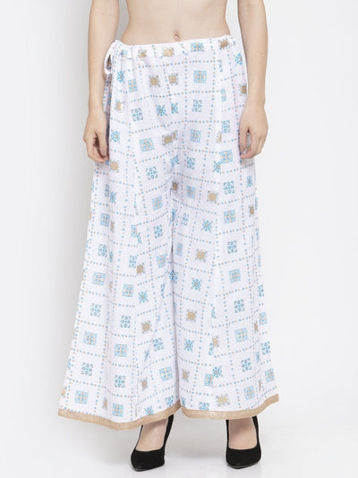 White rayon printed sharara with elastic waistband.