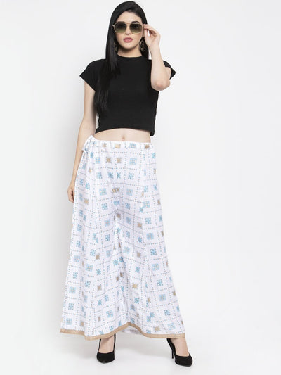 White rayon printed sharara with elasticated waistband and elegant design.