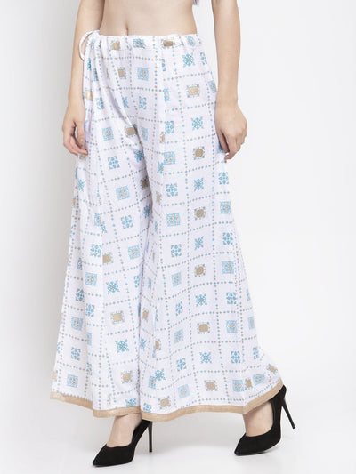 White rayon printed sharara with elastic waistband and elegant design.