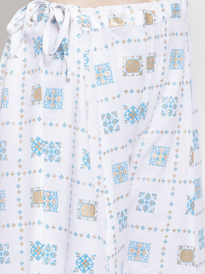 White rayon printed sharara with elastic waistband and blue geometric pattern.