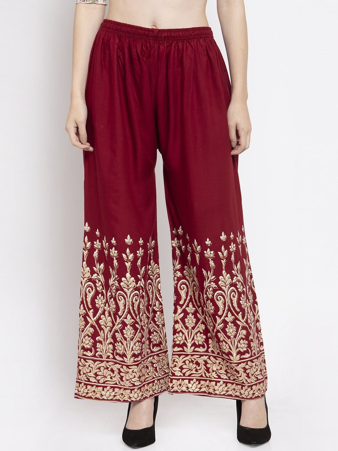 Maroon rayon printed palazzo with elastic waistband and intricate design.