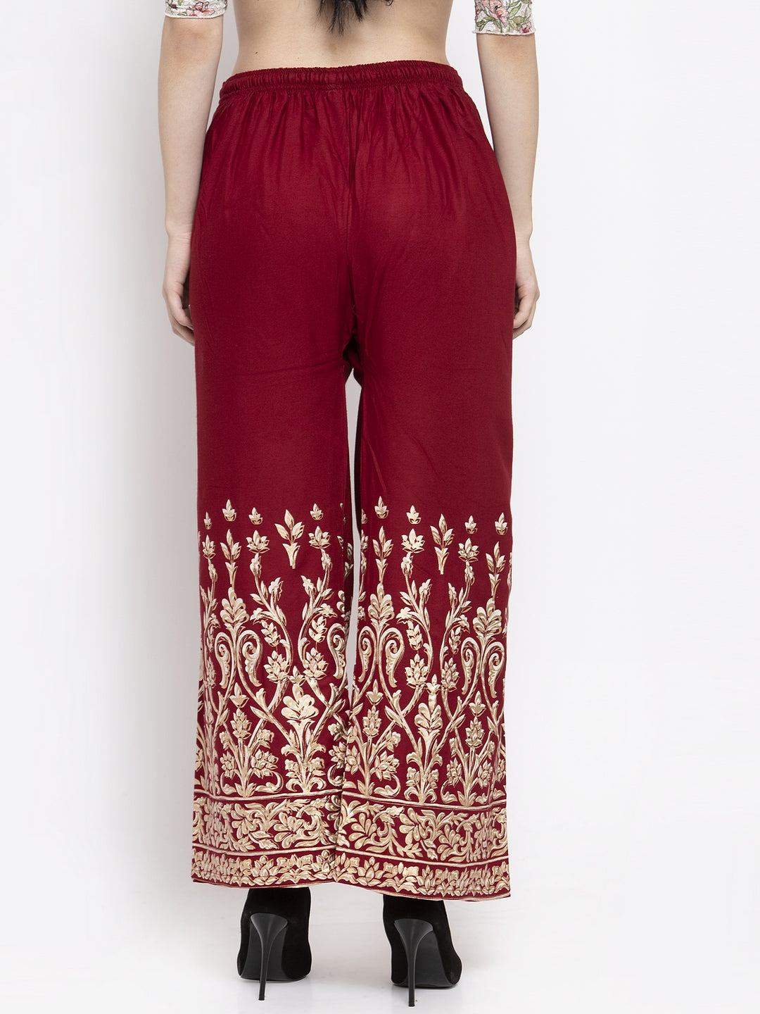 Maroon rayon printed palazzo with elasticated waistband and elegant gold design.
