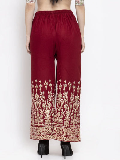 Maroon rayon printed palazzo with elasticated waistband and elegant gold design.