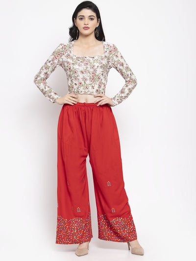 Red rayon printed palazzo with elasticated waistband for a comfortable fit.